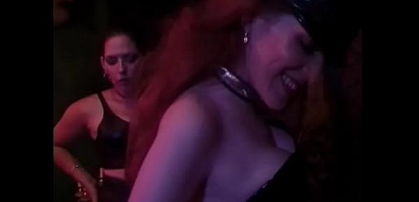  Two impudent chicks in black leather lingerie make a muscle dude lick their boots